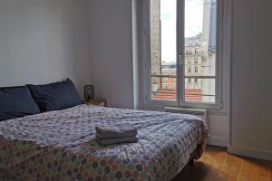 Lova arba lovos apgyvendinimo įstaigoje Lovely Flat in Paris - City center - Nation-Picpus