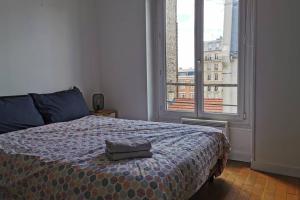 Ένα ή περισσότερα κρεβάτια σε δωμάτιο στο Lovely Flat in Paris - City center - Nation-Picpus