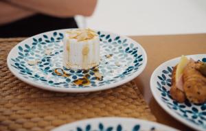 a piece of cake on a plate on a table at Senia_rooms_design in Santa Maria al Bagno