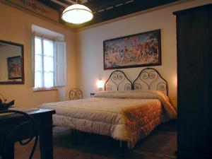 Tempat tidur dalam kamar di Albergo Il Giglio