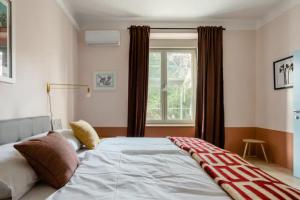 Postel nebo postele na pokoji v ubytování Apartment A.B.S. Secret Oasis