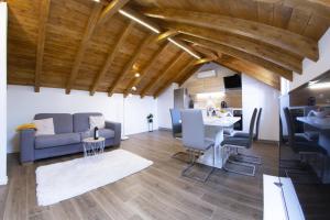 a living room with a couch and a table at Apartmani Klara in Stomorska