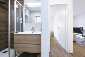 a bathroom with a sink and a mirror at Apartmani Klara in Stomorska +33 photos
