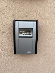 a soap dispenser on the side of a wall at Casa Royale, Boxspring, WiFi, Park for free, E-Wallbox in Gutweiler