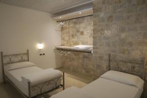 Postel nebo postele na pokoji v ubytování Villa Arianna - Suite Arianna