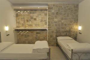 Postel nebo postele na pokoji v ubytování Villa Arianna - Suite Arianna
