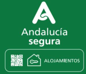 a green and white sign with the words andoglula septura at Sevilla Casa Jucar 4 in Seville