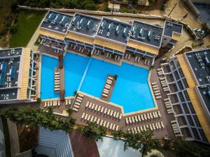 an overhead view of a building with a swimming pool at Gouves Waterpark Holiday Resort in Gouves