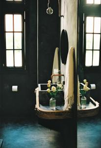 a bathroom with a sink and a tub with flowers on it at Shila Athens in Athens