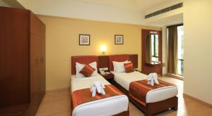 En eller flere senge i et værelse på Sona South City