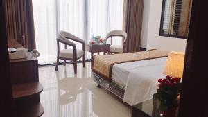 Katil atau katil-katil dalam bilik di Khách sạn Phương Nam