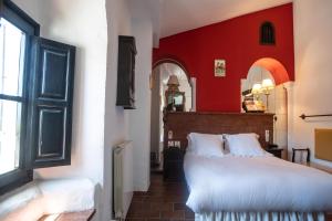 Posteľ alebo postele v izbe v ubytovaní Hotel Soho Boutique Palacio San Gabriel