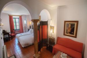 Posteľ alebo postele v izbe v ubytovaní Hotel Soho Boutique Palacio San Gabriel