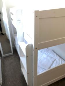 a white cabinet with an open door in a room at Lake View Lodge in Chichester