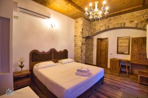 Säng eller sängar i ett rum på Hotel Praga