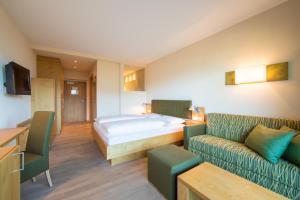 Postel nebo postele na pokoji v ubytování Hilburger Hotel
