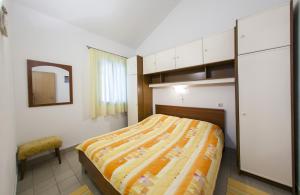 Postel nebo postele na pokoji v ubytování Apartments Magdalena