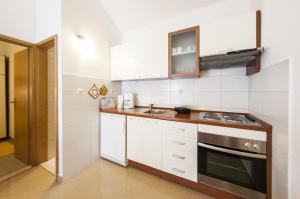 Kuchyň nebo kuchyňský kout v ubytování Apartments Magdalena