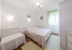 Postel nebo postele na pokoji v ubytování Apartments Magdalena