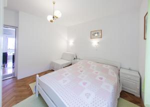 Postel nebo postele na pokoji v ubytování Apartments Magdalena