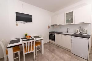 Kuchyň nebo kuchyňský kout v ubytování Apartments Magdalena