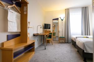 TV a/nebo společenská místnost v ubytování Holiday Inn Express Arras by IHG