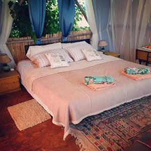 Кровать или кровати в номере Al Aire Libre