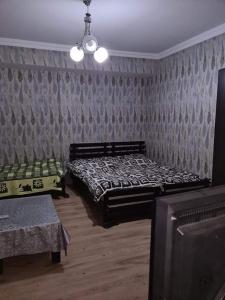 Postel nebo postele na pokoji v ubytování Guest House Nua