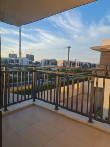 a balcony with a view of a city at 5 bedroom Villa - Dubai Hills in Dubai
