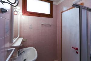 a bathroom with a sink and a shower at Torcello in Bibione