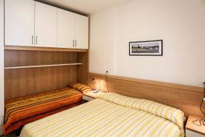 מיטה או מיטות בחדר ב-Ca' Mira Apartments