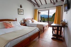 Ένα ή περισσότερα κρεβάτια σε δωμάτιο στο Hotel Mesón de los Virreyes