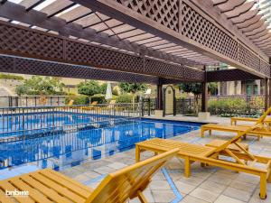 The swimming pool at or near Luxury Designer Interior - Dubai Mall - bnbmehomes - 6018