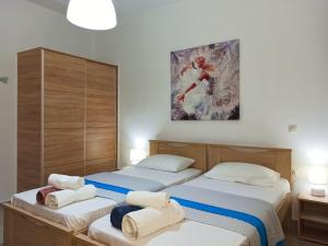 A bed or beds in a room at Villa Amaryllis