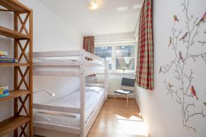 Ein Etagenbett oder Etagenbetten in einem Zimmer der Unterkunft Seestraße 56 Wohnung 7