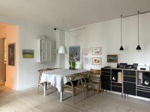 a dining room with a table and chairs at ApartmentInCopenhagen Apartment 547 in Copenhagen