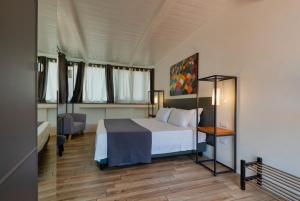 Postel nebo postele na pokoji v ubytování Hotel Casa Mia