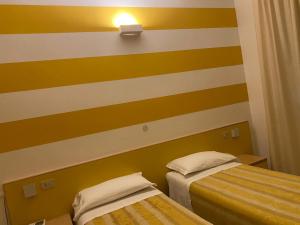 Posteľ alebo postele v izbe v ubytovaní Hotel Savio