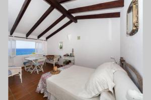 Ένα ή περισσότερα κρεβάτια σε δωμάτιο στο VILLA EN CAP EN FONT