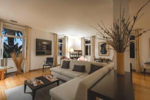 a living room with a couch and a table at Estalagem Da Ponta Do Sol in Ponta do Sol