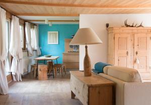 a living room with a couch and a table at CHALET D'ERT in La Valle
