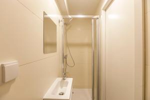 a bathroom with a sink and a shower at LovelyStay - 1st A Mirante in Porto