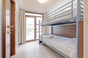 A bed or beds in a room at Hotel Grotto Bagat