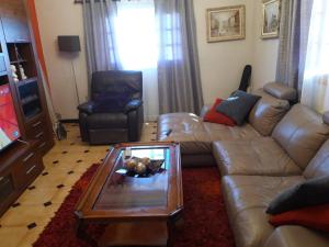 a living room with a couch and a coffee table at Los Molinos in Valles de Ortega