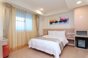 Voodi või voodid majutusasutuse Clownfish Resort toas