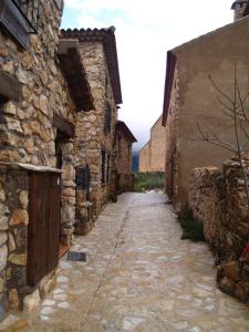an alley in an old stone building at Casa Rural Campoamor in Riópar Viejo +4 photos