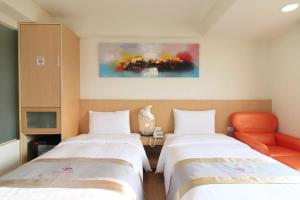 Postel nebo postele na pokoji v ubytování Clownfish Resort