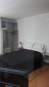 Postel nebo postele na pokoji v ubytování Céntrico A-05
