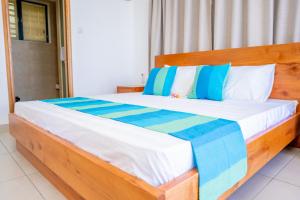 Postel nebo postele na pokoji v ubytování Kolibri Holiday Apartments