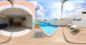 a swimming pool on top of a building at Hotel San Angel Cerca Del Acuario in Veracruz